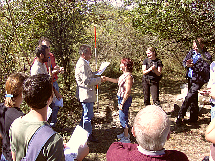 Mr Haase is giving Tara her certificate