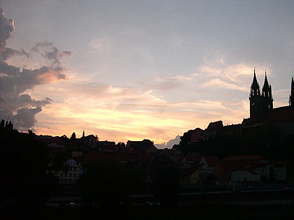 postcard view of the castle set against the sunset
