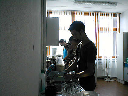 picture of participants in the kitchen doing the dishes